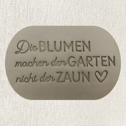 Die Blumen machen den Garten