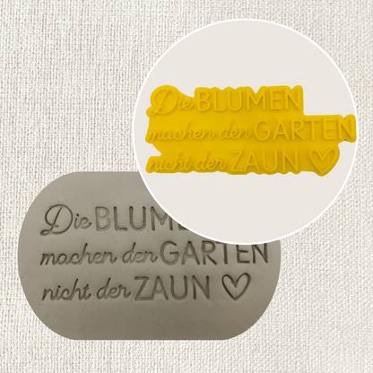 Die Blumen machen den Garten