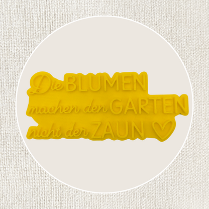 Die Blumen machen den Garten