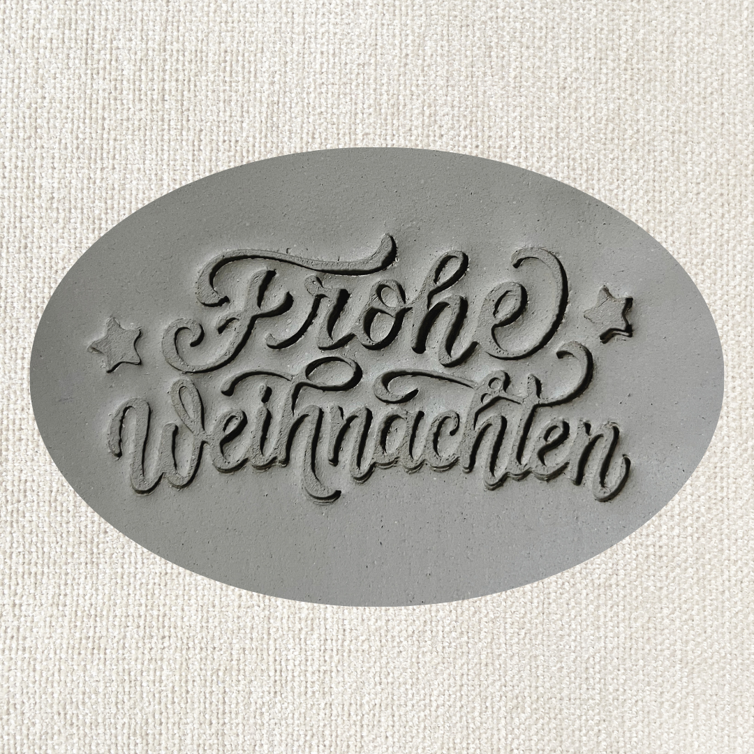 Frohe Weihnachten Tonstempel mit festlichem Weihnachtsdesign für Töpferarbeiten und Dekorationen.