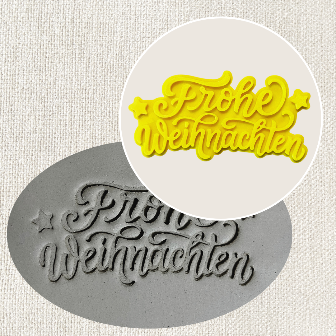 Weihnachtsstempel "Frohe Weihnachten" für Töpferarbeiten, aus Tonstempel- und Überformen-Shop, mit festlichem Design.