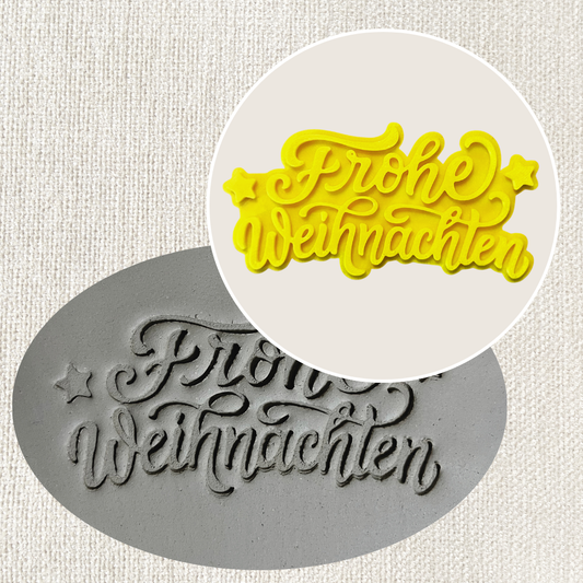 Weihnachtsstempel "Frohe Weihnachten" für Töpferarbeiten, aus Tonstempel- und Überformen-Shop, mit festlichem Design.